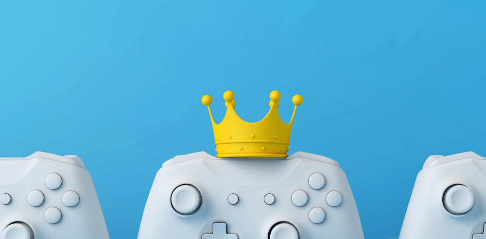 White game controllers with a yellow crown on top, symbolizing leadership in gamification.